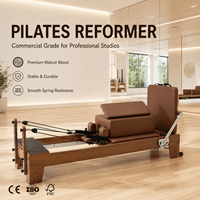 Machine de Pilates Reformer en bois de noyer commercial avec barre de repose-pieds réglable pour studio professionnel