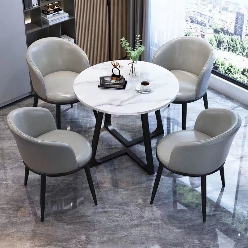 1 table pieds noirs+4 chaises cuir gris