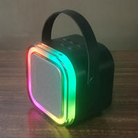 Mini Altavoz Karaoke Portátil 5.3 con Luces LED RGB, Carcasa de Bambú, Micrófono Integrado, Control Remoto, Compatible con Aplicaciones, Batería de 1000-2000mAh para Niños