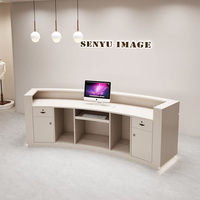 Comptoir laqué moderne semi-circulaire personnalisé de luxe de lumière de bureau de réception pour le magasin d'habillement de salon de beauté caissier incurvé