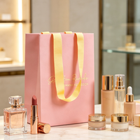 Sac en papier de luxe personnalisé avec poignée en ruban pour emballage de boutique, design imprimé rose pour lotion, cosmétiques, rouge à lèvres, perruques