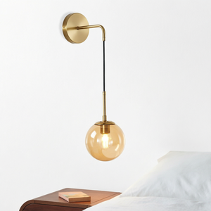 Applique murale suspendue en verre ambré de style Mid-Century Modern alliant un design minimaliste avec une éclairage chaleureuse et atmosphérique pour sublimer l'espace. - Product Image 1