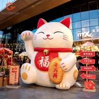 Meilleures ventes : Décoration du Nouvel An - Chat porte-bonheur gonflable Maneki Neko avec lunettes de soleil tendance et pièce d'or