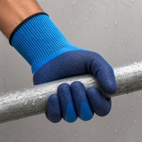 Gants en latex bleu de longueur poignet avec revers en tricot côtelé élastique, paume enduite imperméable et antidérapante pour usage industriel