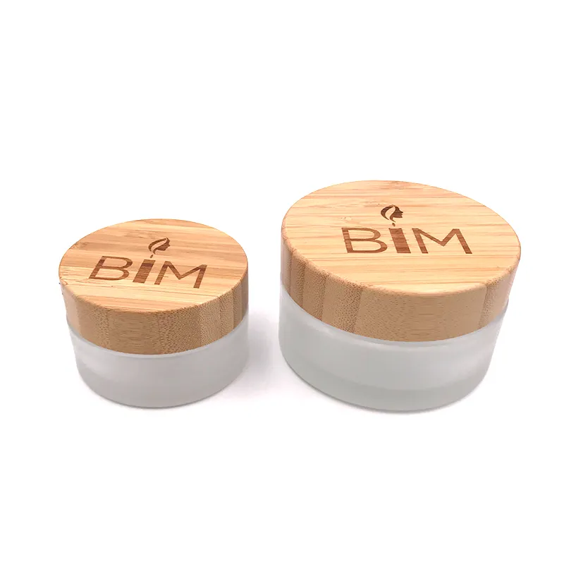 Custom Empty Bamboo Cosmetic Packaging Jar 30ml 50ml 100ml Black Frosted Wooden Glass Jar With Bamboo Lid