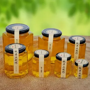 Fabricants de bouteilles en verre hexagonales en gros, bouteille de miel, cornichons, pot de confiture en verre