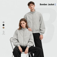 Blouson Bomber Unisexe Hydrofuge Col Montant Fermeture Éclair Manches et Ourlet Côtelés Coupe Ample Vêtement d'Extérieur Décontracté Vente en Gros