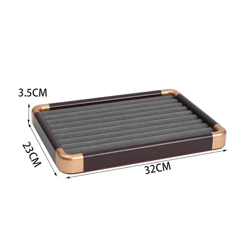 Golden rounded ring tray with gray lining