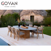 Nouvelle table à manger rectangulaire d'extérieur : mobilier de patio de luxe avec plateau en pierre et pieds en teck, idéal pour les hôtels de jardin