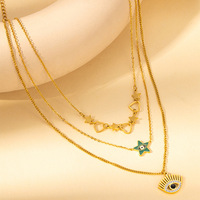 Collier superposé en acier inoxydable plaqué or 18 carats avec pendentif émeraude vert, breloque étoile et chaîne de pull pour femme