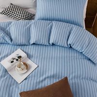 Nouvelle housse de couette rayée bleue, douce et respirante, taie d'oreiller soyeuse et lisse, ensemble de housse de couette de luxe discret pour hôtel
