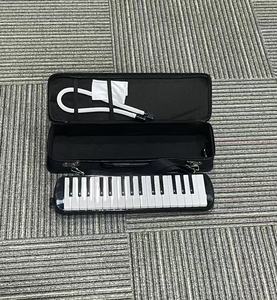 Melódica al por mayor de fábrica, 32/37 teclas, logotipo personalizado, instrumento musical de viento con caja de regalo para distribuidores escolares - Product Image 4