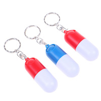 NBLUESKY Promo Cadeau Porte-clés Boîte à bonbons en forme de capsule Distributeur de pilules et de tablettes portable