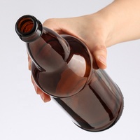 Botella de vidrio de cerveza transparente marrón ámbar de alta calidad de 330ml con tapa