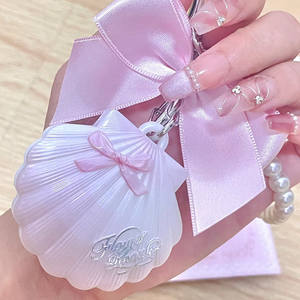 Flower Knows Shell's Jewel Bag Colgante de Concha con Lazo, Crema Iluminadora, Piedra Lunar, Lágrimas Azules, Tridimensional, Nacarado - Product Image 1