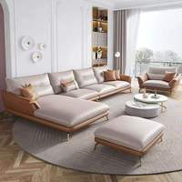 Ensemble de canapés d'angle en cuir véritable confortable et personnalisé de style européen, avec des pieds en métal doré élancés