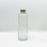 Bouteille d'eau en verre sodocalcique texturé gaufré de grande capacité 1000 ml