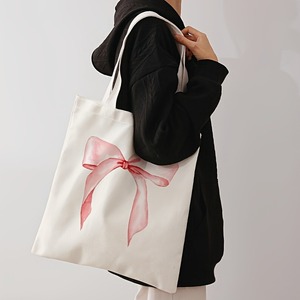 Sacs fourre-tout en toile épaisse de 16 oz, réutilisables, en coton, style minimaliste, avec nœud rose festif et longue bandoulière, pour la vente en gros - Product Image 1