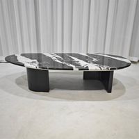 Table basse ovale en marbre noir et blanc avec base en acier inoxydable noir