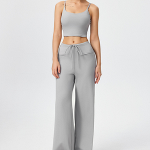 Set consisting of a sleeveless sports vest and loose-fitting, straight-leg <b>trousers</b> with an adjustable <b>drawstring</b>. - Product Image 1