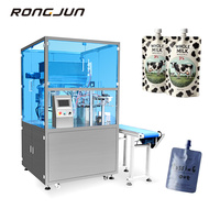 Machine de remplissage et de capsulage de poche à bec liquide rotatif de bureau électrique pour l'emballage de boisson à la gelée de jus dans des sachets à bec