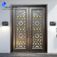 Porte d'entrée double en fer forgé de luxe avec accents dorés, décor floral orné et verre dépoli pour villa