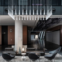 Lustre LED moderne de luxe de style tube en verre pour intérieur, grand modèle personnalisé pour projets de luxe