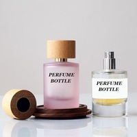 Flacon pulvérisateur de parfum rond cylindrique de 30ml 50ml 100ml personnalisé flacons de parfum en verre rose transparent à sertir vides avec boîte tubulaire