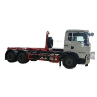 Camion compacteur diesel Sinotruk Howo à double essieu arrière avec bras de ramassage, camion à ordures de 25 tonnes, chargeur de déchets