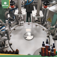 Remplisseuse automatique de haute précision à commande PLC pour liquides visqueux 30ml 50ml, à engrenages motorisés, pour huiles essentielles, boissons et produits chimiques