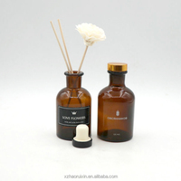 Vente en gros Bouteille vide ronde de luxe avec diffuseur d'arôme en verre ambré 125ml 250ml