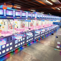 Machine de jeu d'arcade de luxe à griffes pour la remise de prix, avec vitrine de présentation de boîtes surprises, pour centre de divertissement familial