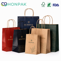Sacs cadeaux en papier de Noël personnalisés avec poignée, logo imprimé, sacs de shopping pour les fêtes, emballage de vente au détail pour les marques HONPAK