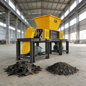 Broyeur robuste à double arbre avec moteur pour le recyclage des pneus usagés et le broyage des blocs de caoutchouc - Product Image 1