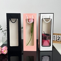 Fabricant de sacs cadeaux en PVC en stock sacs en papier de vin rouge à fenêtre transparente à longue bande pour emballage de bouquet de parfum à bougie