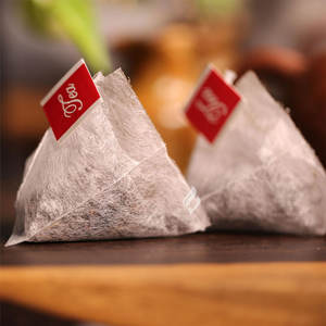 Bolsa de té de fibra de maíz degradable <span class=keywords><strong>PLA</strong></span> bolsa de filtro de té desechable bolsa de té <span class=keywords><strong>triangular</strong></span> personalizada - Product Image 1