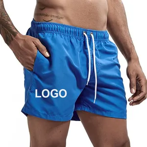 Quick dry big size polyester oem custom logo sports causal men's beach shorts on stock gym running pants men's shorts