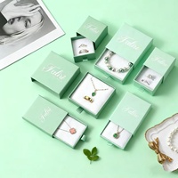 Boîte rigide de luxe à tiroir coulissant avec ruban, gaufrée, pour bijoux de marque Signature, boîte d'identité avant-gardiste