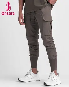 Ropa de gimnasio 20% pantalones de poliéster Joggers OEM logotipo personalizado al por mayor Fitness deportes Casual hombres Jogging Jogger 80% Algodón para hombres