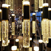 Design rotatif de lustre en cristal Long de bâtiment duplex de luxe d'or noir pour des lumières pendantes d'escalier élevé de villa d'appartement de grenier