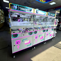 Nouvelle machine à grue métallique pour deux joueurs, une sensation en ligne très prisée, idéale pour les salles d'arcade, centres commerciaux, supermarchés, pour attraper les peluches.