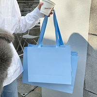 Sacs shopping en papier haut de gamme pour vêtements féminins, salons de beauté, boutiques, emballages cadeaux, sacs fourre-tout, logo personnalisé, vente en gros