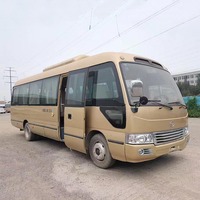Autobus de tourisme électrique Lhd Coaster 60kw d'occasion, autobus Coaster 30 places, promotion autocars