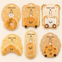Vente en gros de porte-clés et pendentifs de sac à dos pour enfants, en forme de pain de dessin animé mignon, en peluche, en alliage et en métal