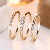 Nouvelles bagues tendance simples 2025 en cuivre plaqué or avec micro-incrustations de zircon blanc, ensemble de trois pièces géométriques pour couple, pour l'index