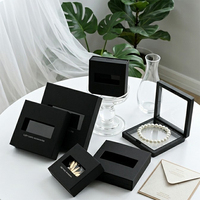 Boîte à bijoux flottante creuse en film PE, présentoir anti-ternissement en carton noir pour bagues, boucles d'oreilles, bracelets – Fabricant