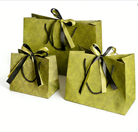 Sac de transport cosmétique haut de gamme pour femme, avec nœud, en papier artistique, logo personnalisé, finition argentée bronzée, robuste, durable et réutilisable pour le maquillage