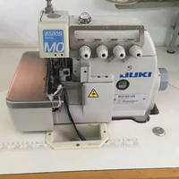 Machine à coudre industrielle surjeteuse Mojuki-6500 d'occasion en bon état, point de sécurité, plateau plat blanc, certifiée CE