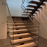 Escalier flottant sur mesure en acier au carbone avec marches en bois et garde-corps en verre pour la maison