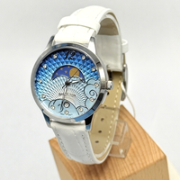 Montre en acier inoxydable pour femme, cadran bleu lune, bracelet en cuir blanc, quartz, étanche, design haut de gamme, élégance classique, vente en gros